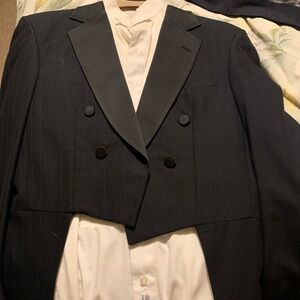 Vintage tux with tails and pleated white shirt.